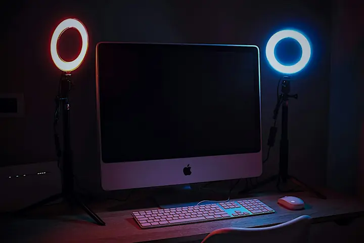 A streaming desk with lights and a camera