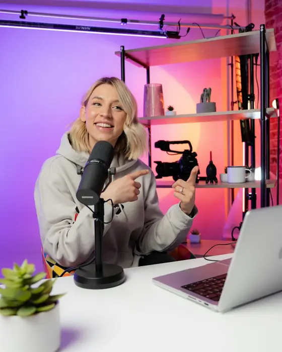 A creator streaming from a lit studio desk